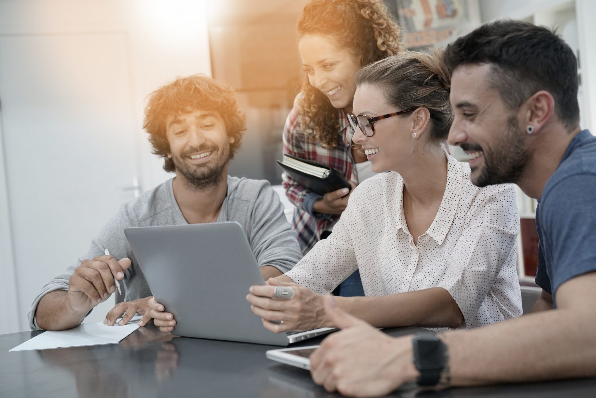 Young people meeting with laptop computer